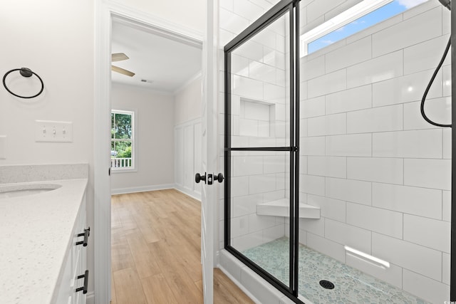 2426 Park St, North Myrtle Beach, SC 29582 - full bathroom with crown molding, a stall shower, vanity, and wood finished floors
