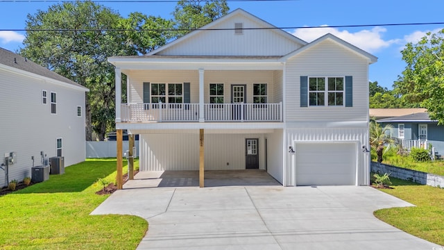 2426 Park St, North Myrtle Beach, SC 29582 - coastal inspired home with driveway, an attached garage, a carport, and a balcony