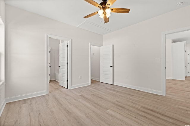 2426 Park St, North Myrtle Beach, SC 29582 - unfurnished bedroom featuring a walk in closet, light wood-style flooring, and ceiling fan