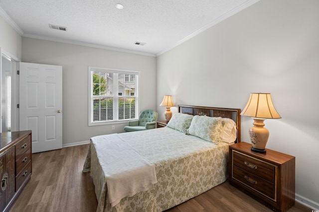 503 20th Ave N Unit 9D, North Myrtle Beach, SC 29582 - bedroom with dark wood-type flooring, crown molding, and a textured ceiling