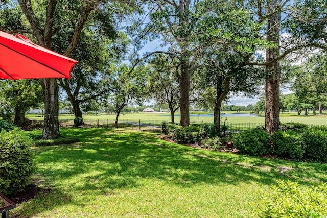 503 20th Ave N Unit 9D, North Myrtle Beach, SC 29582 - view of yard featuring a water view and view of wooded area