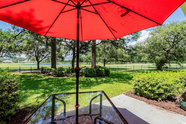 503 20th Ave N Unit 9D, North Myrtle Beach, SC 29582 - fenced backyard with view of scattered trees and a water view