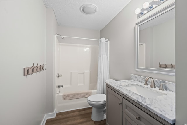 503 20th Ave N Unit 9D, North Myrtle Beach, SC 29582 - full bathroom featuring wood finished floors, vanity, shower / bath combination with curtain, and a textured ceiling