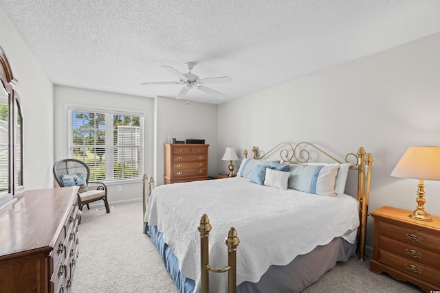 503 20th Ave N Unit 9D, North Myrtle Beach, SC 29582 - bedroom featuring carpet flooring, a ceiling fan, and a textured ceiling