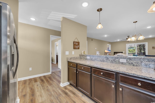 125 S Shore Dr Unit 204, Longs, SC 29568 - kitchen featuring stainless steel fridge, a chandelier, dark brown cabinetry, light wood-style floors, and pendant lighting
