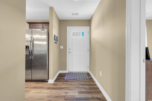 125 S Shore Dr Unit 204, Longs, SC 29568 - kitchen with appliances with stainless steel finishes, dark brown cabinetry, light wood-style flooring, recessed lighting, and light stone counters