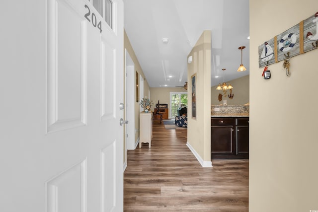 125 S Shore Dr Unit 204, Longs, SC 29568 - hall featuring wood finished floors and a chandelier