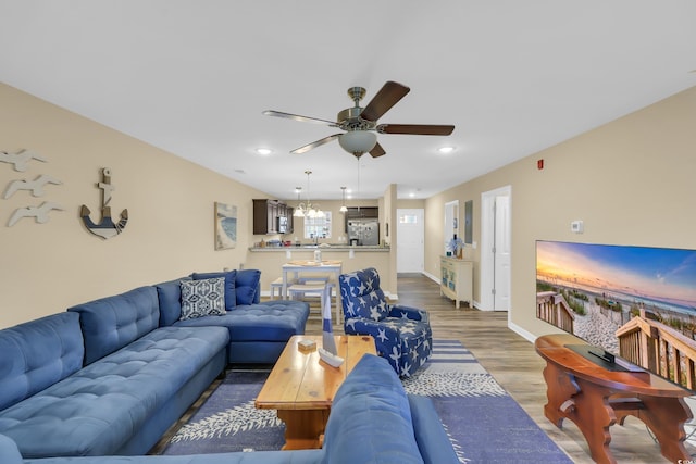 125 S Shore Dr Unit 204, Longs, SC 29568 - living area featuring a ceiling fan, recessed lighting, wood finished floors, and a chandelier