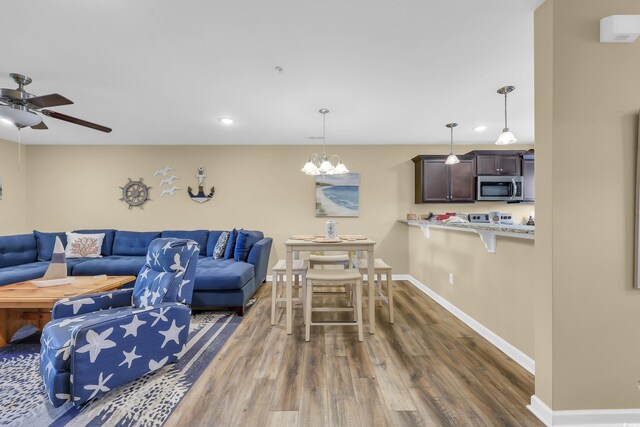 125 S Shore Dr Unit 204, Longs, SC 29568 - living area featuring a ceiling fan, wood finished floors, and recessed lighting