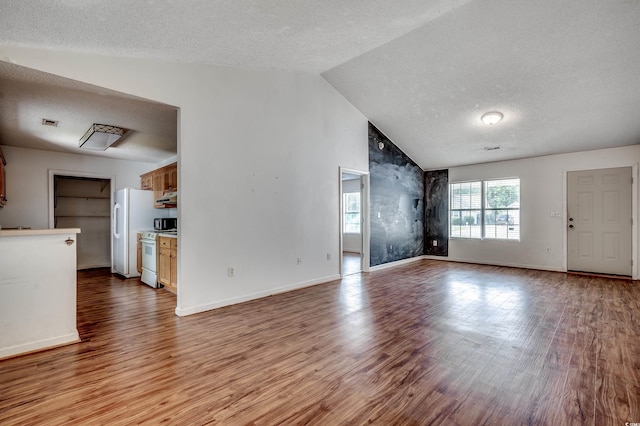 1836 Juniper Dr, Conway, SC 29527 - unfurnished living room with a textured ceiling, wood finished floors, and lofted ceiling