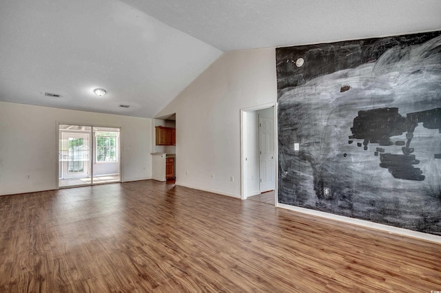 1836 Juniper Dr, Conway, SC 29527 - unfurnished living room featuring wood finished floors and vaulted ceiling