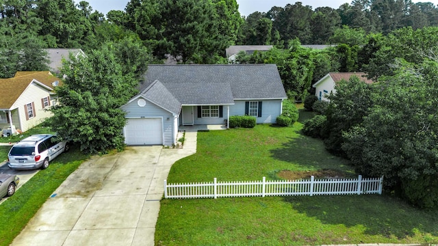 1836 Juniper Dr, Conway, SC 29527 - view of front facade with a fenced front yard, driveway, an attached garage, roof with shingles, and a porch