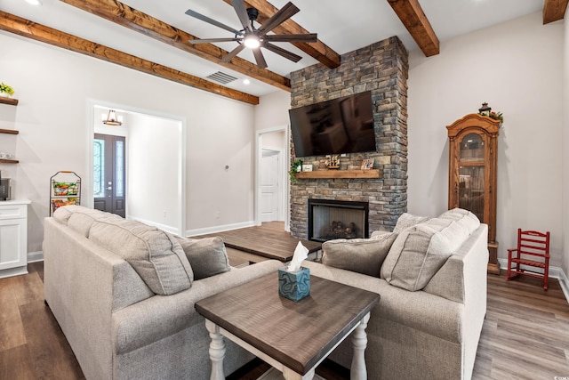 609 Mccown Dr, Conway, SC 29526 - living room with beamed ceiling, a ceiling fan, wood finished floors, a stone fireplace, and recessed lighting