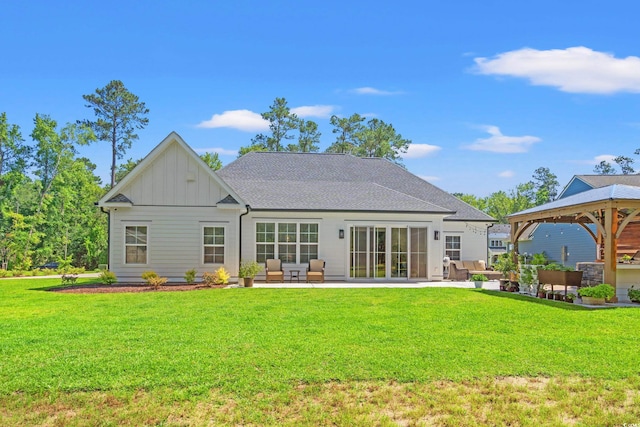 609 Mccown Dr, Conway, SC 29526 - back of house with a gazebo, board and batten siding, a patio, and a lawn