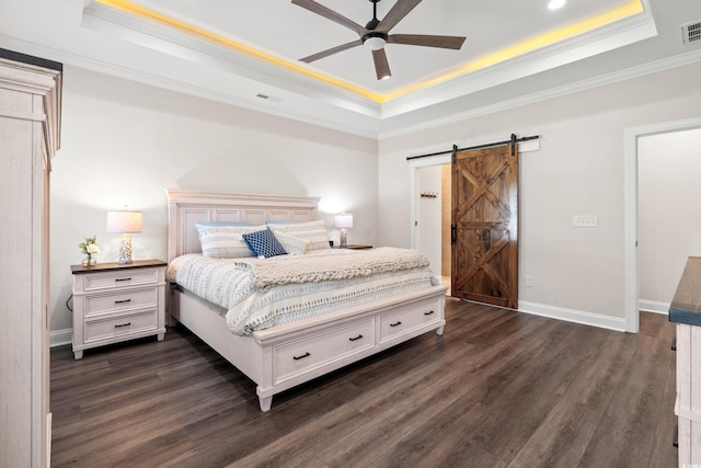 609 Mccown Dr, Conway, SC 29526 - bedroom with a raised ceiling, a barn door, ornamental molding, dark wood-style flooring, and ceiling fan
