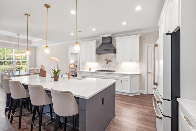 609 Mccown Dr, Conway, SC 29526 - kitchen featuring premium range hood, freestanding refrigerator, gas cooktop, crown molding, and backsplash