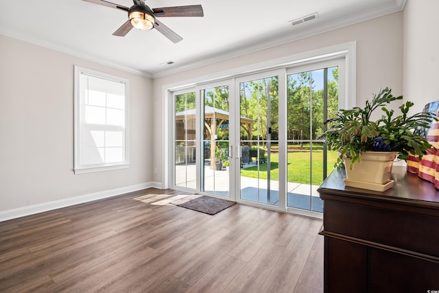 609 Mccown Dr, Conway, SC 29526 - entryway with a ceiling fan, light wood-style flooring, plenty of natural light, and crown molding