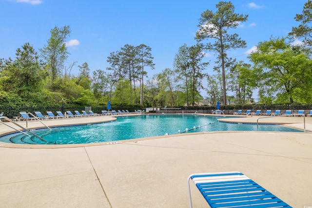 609 Mccown Dr, Conway, SC 29526 - community pool with a patio and view of wooded area