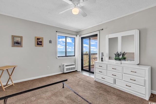 5601 N Ocean Blvd Unit A309, Myrtle Beach, SC 29577 - carpeted bedroom featuring a textured ceiling, access to outside, a wall mounted AC, ceiling fan, and crown molding