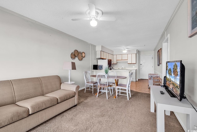 5601 N Ocean Blvd Unit A309, Myrtle Beach, SC 29577 - living area with ceiling fan, light carpet, and a textured ceiling