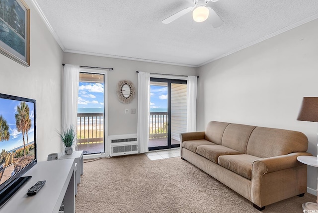 5601 N Ocean Blvd Unit A309, Myrtle Beach, SC 29577 - living room with light colored carpet, a textured ceiling, ceiling fan, and ornamental molding