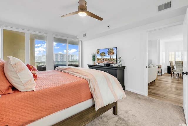 139 S Dunes Dr Unit 304, Pawleys Island, SC 29585 - bedroom with multiple windows, carpet, and ceiling fan