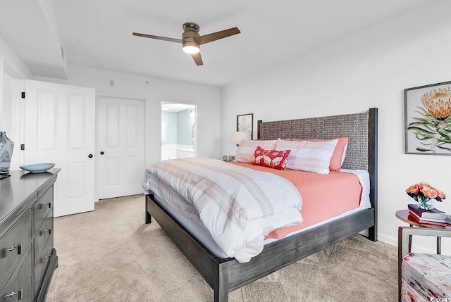 139 S Dunes Dr Unit 304, Pawleys Island, SC 29585 - bedroom with light colored carpet, ceiling fan, and ensuite bath