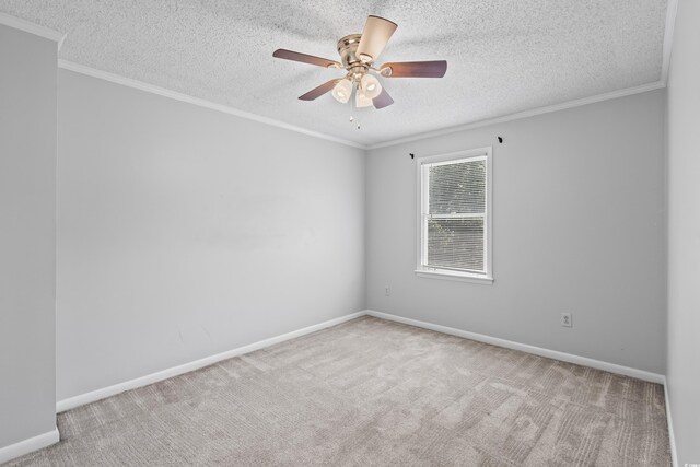 4115 Little River Rd Unit 1-E, Myrtle Beach, SC 29577 - unfurnished room featuring a textured ceiling, carpet, ornamental molding, and ceiling fan