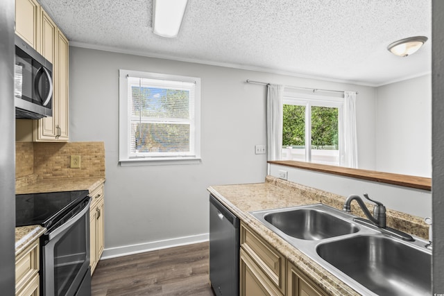4115 Little River Rd Unit 1-E, Myrtle Beach, SC 29577 - kitchen with stainless steel appliances, cream cabinetry, dark wood-style flooring, a textured ceiling, and light countertops