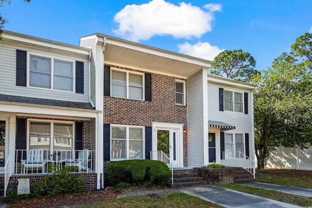 4115 Little River Rd Unit 1-E, Myrtle Beach, SC 29577 - townhome / multi-family property with a porch