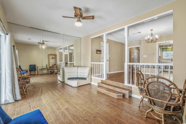 4701 N Kings Hwy Unit 8, Myrtle Beach, SC 29577 - living area with a chandelier, a ceiling fan, and wood finished floors