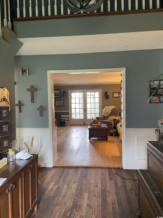 1872 Harris Short Cut Rd, Conway, SC 29526 - hallway with dark wood-style floors, a wainscoted wall, and french doors