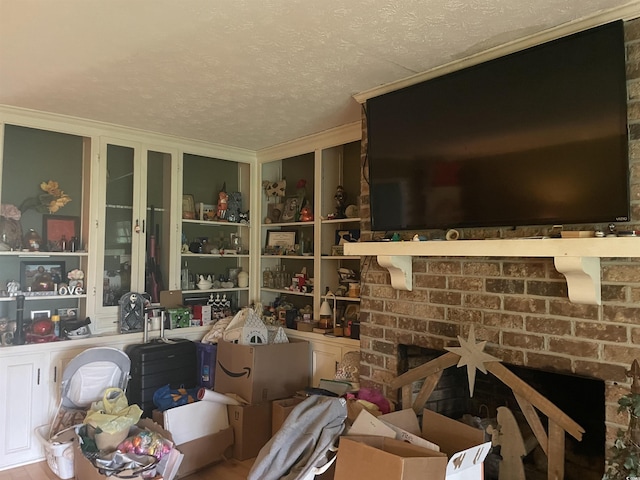 1872 Harris Short Cut Rd, Conway, SC 29526 - interior space with a textured ceiling, a fireplace, and crown molding