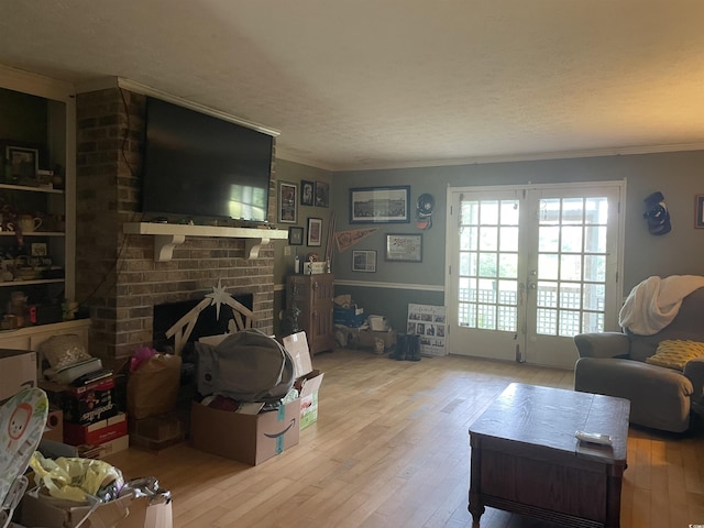 1872 Harris Short Cut Rd, Conway, SC 29526 - living area with wood-type flooring, crown molding, a fireplace, and french doors