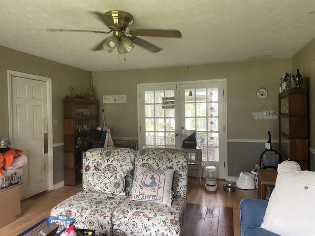 1872 Harris Short Cut Rd, Conway, SC 29526 - living area with ceiling fan, wood finished floors, a textured ceiling, and wainscoting