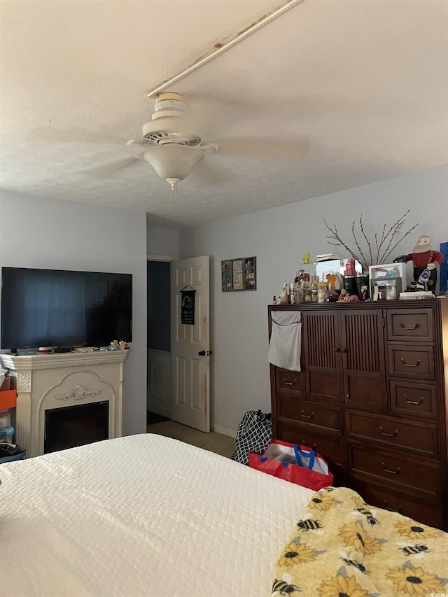 1872 Harris Short Cut Rd, Conway, SC 29526 - carpeted bedroom with a fireplace and a ceiling fan