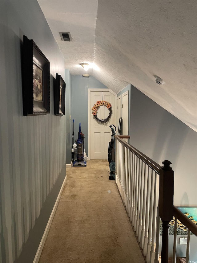1872 Harris Short Cut Rd, Conway, SC 29526 - corridor featuring lofted ceiling, a textured ceiling, light colored carpet, and an upstairs landing