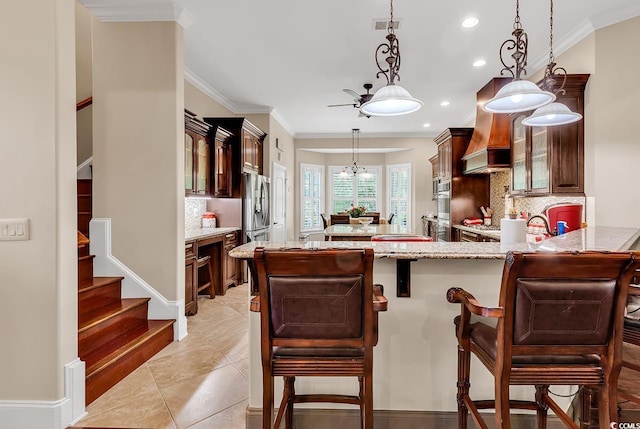 487 Trestle Way, Conway, SC 29526 - kitchen featuring custom exhaust hood, stainless steel appliances, tasteful backsplash, glass insert cabinets, and ornamental molding