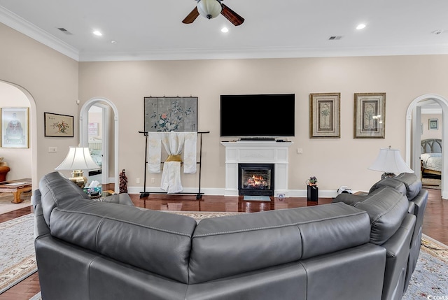487 Trestle Way, Conway, SC 29526 - living room with arched walkways, a ceiling fan, ornamental molding, a glass covered fireplace, and recessed lighting