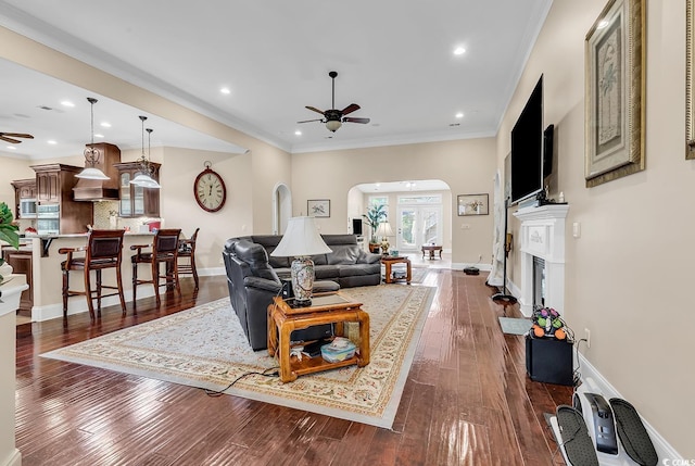 487 Trestle Way, Conway, SC 29526 - living room with a ceiling fan, arched walkways, a fireplace with raised hearth, dark wood-type flooring, and recessed lighting