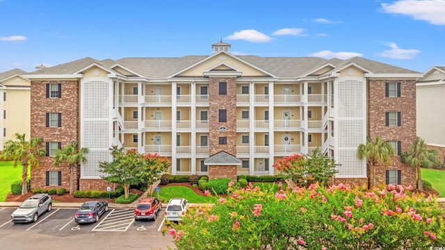 4865 Luster Leaf Cir Unit 402, Myrtle Beach, SC 29577 - view of building exterior featuring uncovered parking