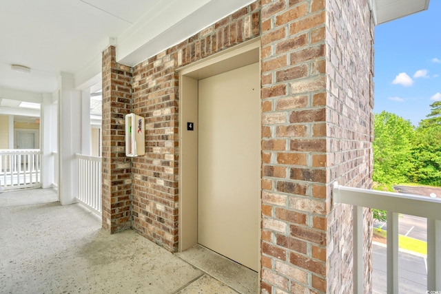 4865 Luster Leaf Cir Unit 402, Myrtle Beach, SC 29577 - doorway to property with brick siding and elevator