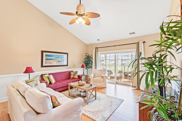 4865 Luster Leaf Cir Unit 402, Myrtle Beach, SC 29577 - living room featuring light wood-style flooring, high vaulted ceiling, a ceiling fan, and a wainscoted wall