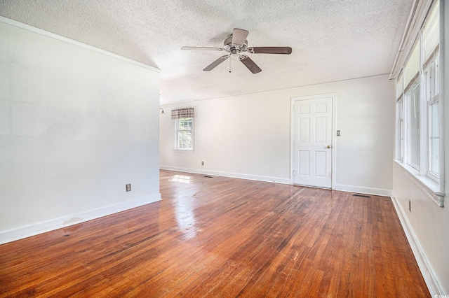 320 Edgewood Cir, Conway, SC 29527 - spare room with a textured ceiling, a ceiling fan, and wood-type flooring