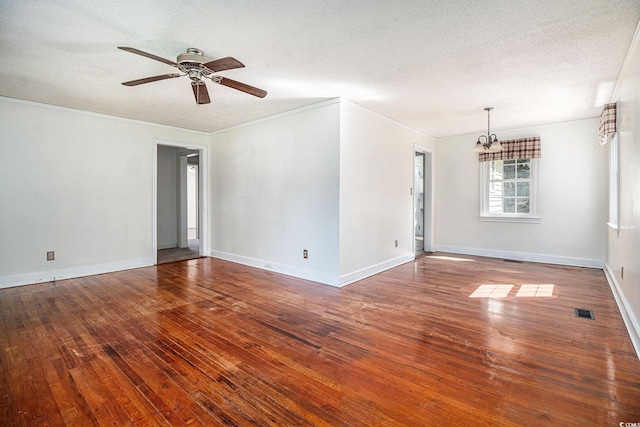 320 Edgewood Cir, Conway, SC 29527 - spare room featuring hardwood / wood-style floors, a chandelier, a ceiling fan, a textured ceiling, and crown molding
