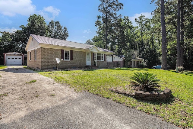 320 Edgewood Cir, Conway, SC 29527 - single story home featuring driveway, an outbuilding, brick siding, a front lawn, and a metal roof