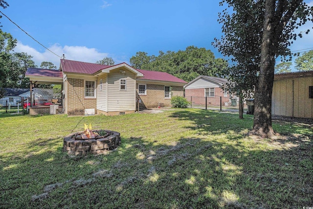 320 Edgewood Cir, Conway, SC 29527 - back of house with an outdoor fire pit, crawl space, and a metal roof