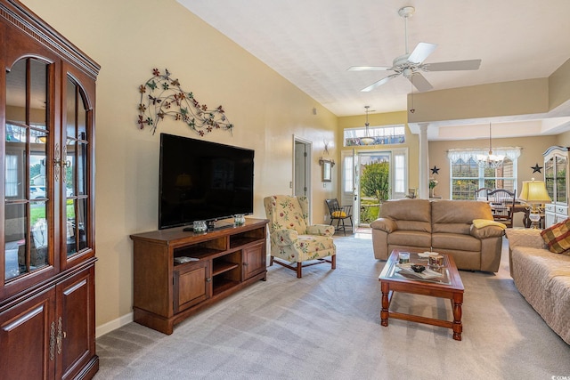 4726 Southern Trl, Myrtle Beach, SC 29579 - living area featuring light colored carpet, a chandelier, a ceiling fan, and a high ceiling