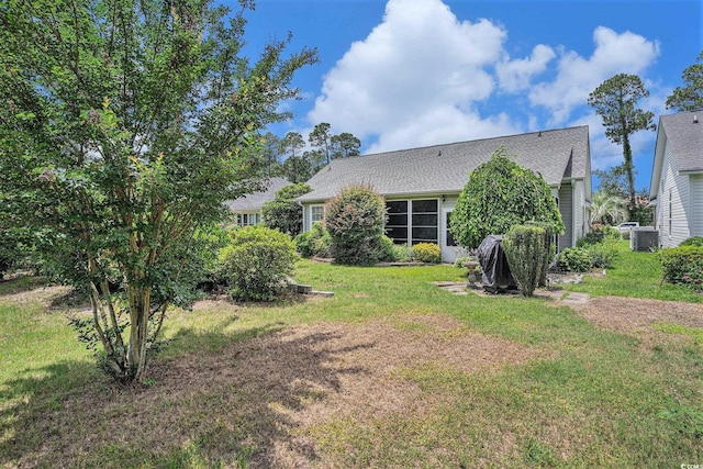 4726 Southern Trl, Myrtle Beach, SC 29579 - rear view of house with a lawn and roof with shingles
