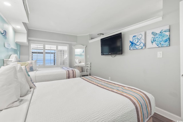 4800 S Ocean Blvd Unit 520, North Myrtle Beach, SC 29582 - bedroom with ornamental molding and wood finished floors